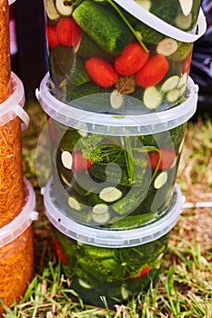 Canned pickles and tomatoes in jars. Preparations for the winter.