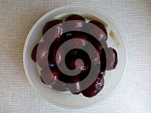 Canned plums in a bowl for a picnic