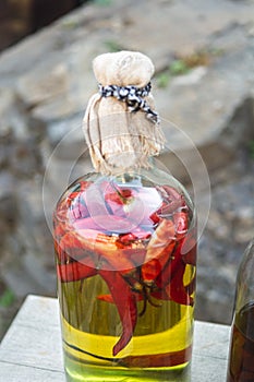 Canned red peppers in a bottle with oil, homemade preserves