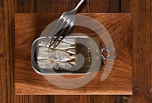 Canned sardine on wooden