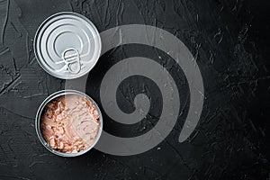 Canned soy free albacore white meat tuna, in tin can, on black background, top view flat lay, with copyspace  and space for text