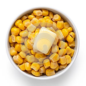 Canned sweet corn with a knob of butter in a white ceramic bowl isolated on white. Top view