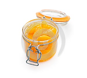 Canned tangerine. Pickled mandarin fruit in jar isolated on white background