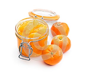 Canned tangerine. Pickled mandarin fruit in jar isolated on white background