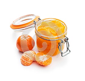 Canned tangerine. Pickled mandarin fruit in jar isolated on white background