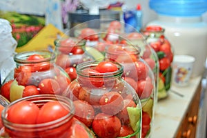 Canned tomato marinated in glass jars at home