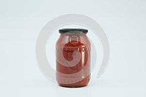 Canned tomato paste in a glass jar. Home canning. Long-term food