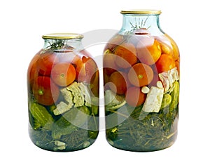 Canned tomatoes and cucumbers in a glass jar