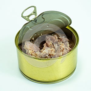 Canned tuna from albacore white meat without soy, packed in water. an open tuna can on the table. Canned tuna fillet.