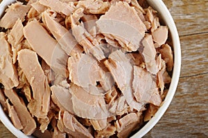Canned tuna fish at on background