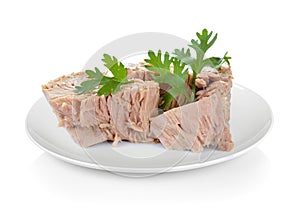 Canned tuna fish in plate on white background