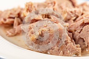 Canned Tuna Fish Slices Served On The White Plate