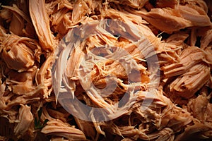 Canned tuna shredded closeup. Texture of flaked tuna