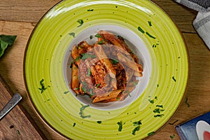 Canned Tuna tomato garlic parsley salad on a wooden table.Flat lay, selective focus