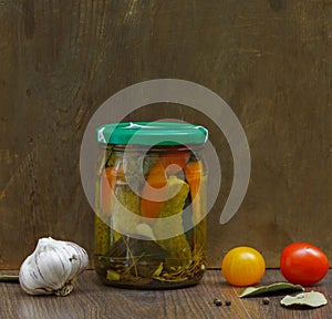 Canned vegetables in a jar on a brown background