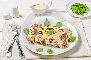 Cannelloni with minced beef and spinach baked in bÃ©chamel sauce