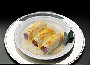 Cannelloni stuffed with meat with bechamel sauce
