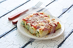 Canneloni stuffed with ricotta and spinach photo