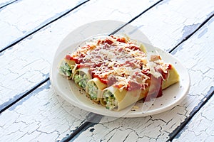 Canneloni stuffed witn ricotta and spinach photo