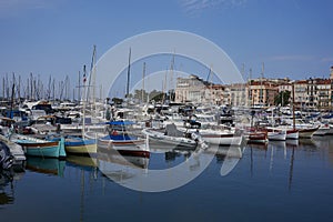 Cannes, France - June 16, 2021 - view of the Old Port - historical site with classic sailboat and modern yachts hosting celebritie