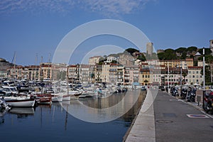 Cannes, France - June 16, 2021 - view of the Old Port - historical site with classic sailboat and modern yachts hosting celebritie