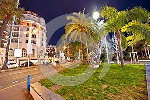 Cannes. Palm waterfront architectue in town of Cannes evening view