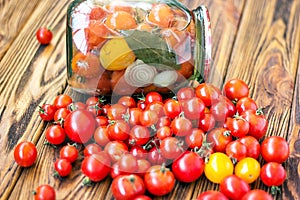 Canning fresh tomatoes with onions in jelly marinade. Vegetable salads for winter. Glass jar of homemade tasty canned tomatoes clo