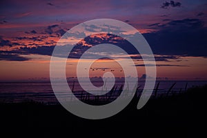 Cannon Beach at sunset: scenic orange, red and purple skies