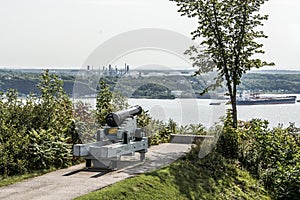 Cannon in Quebec City Canada plaines Abraham overlooking Saint Lawrence river and Jean-Gaulin Refinery in Levis town