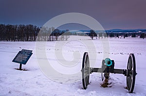 Cannon in a snow-covered field in Gettysburg, Pennsylvania.