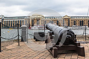 A cannon at the Thames river. Butlers Wharf, London.