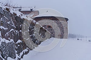 Cannon tower of the Hame Castle (Tavastia castle) on a snowy day in winter photo