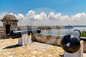 Cannons at Fort of Saint Charles and cruise ship in Havana