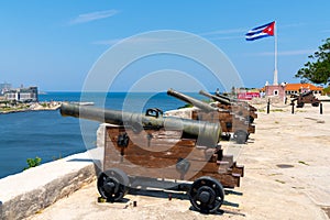 Cannons at Fort of Saint Charles, cuban flag in Havana