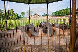 Cannons guarding the palace--Kareng Ghar or Talatal Ghar Rangpur, Sivasagar, Assam. photo