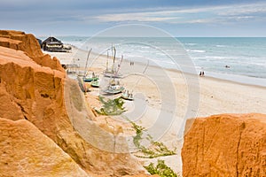 Canoa beach with red cliffs photo