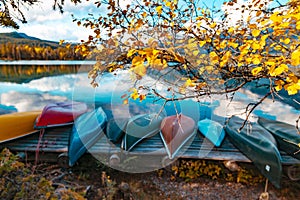 Canoe ashore by mountain lake