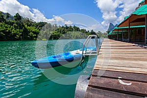 Canoe in a beautiful mountains lake forest and river natural attractions in Ratchaprapha Dam at Khao Sok National Park, Surat Than