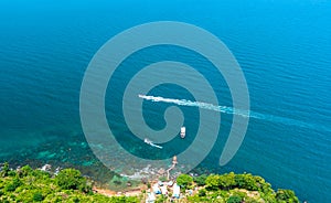 Canoe boat carrying tourists glides in the beautiful bay