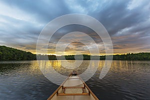 Canoe bow on a Canadian lake at sunset