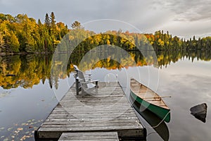 Canoe and Dock on an Autumn Lake - Ontario, Canada photo