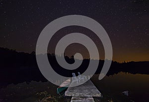 Canoe at dock under a September night sky - Ontario, Canada