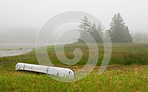 Canoe on inlet in fog photo