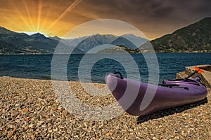 Canoe on Lake Como at sunset