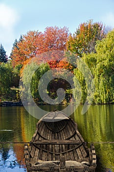 Canoe on lake during fall.