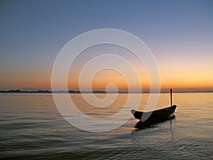 Canoe in sunset