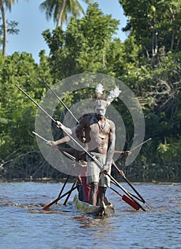 Canoe war ceremony of Asmat people. Headhunters of a tribe of Asmat