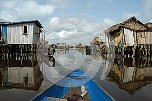 Canoeing through African village