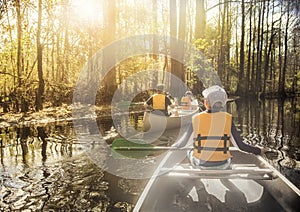 Canoeing down beautiful river in a Cypress Forest