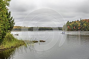 Canoeing on a Lake in Autumn - Algonquin Provincial Park, Ontario, Canada